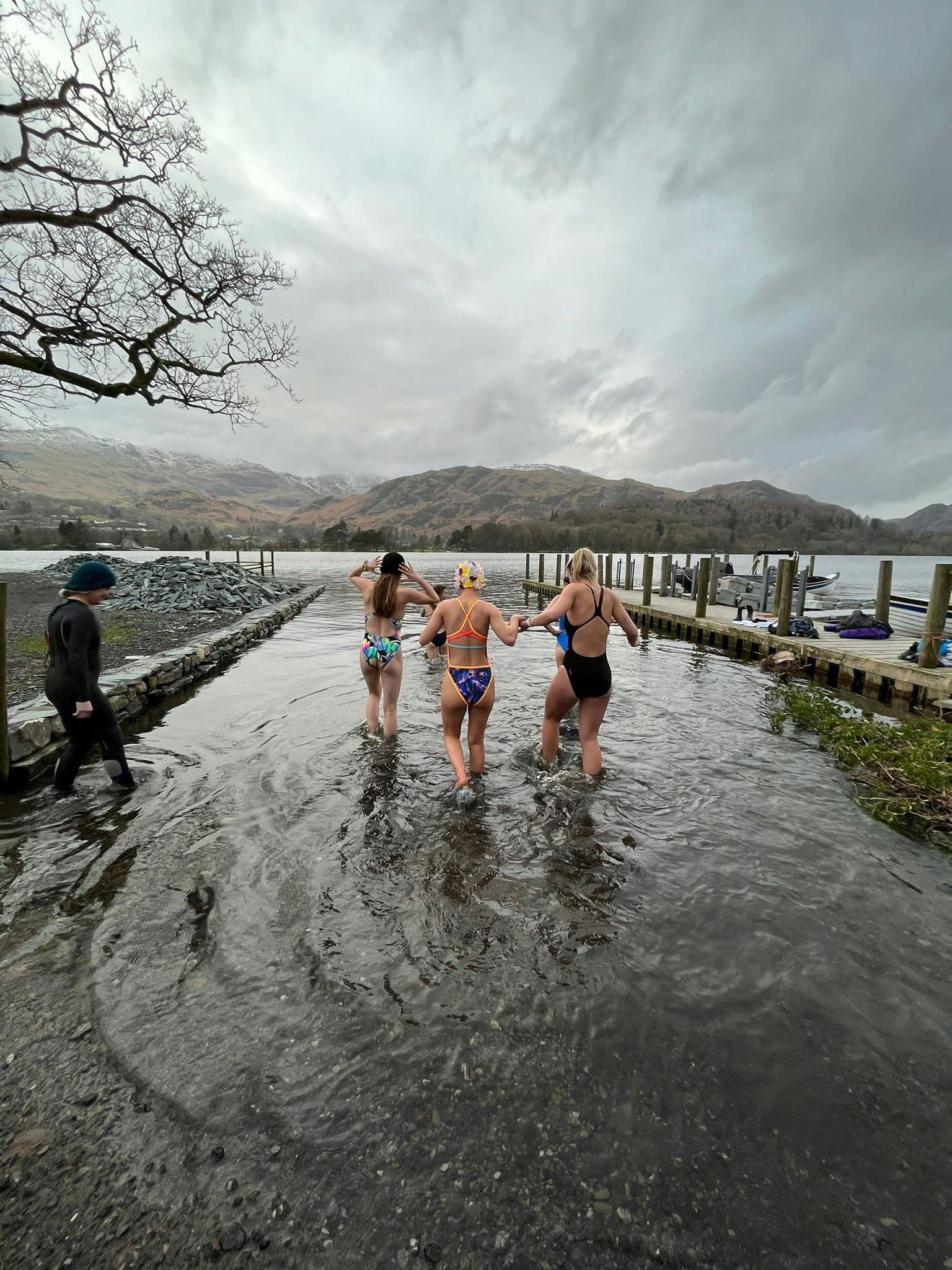 Women going wild swimming in a lake 
